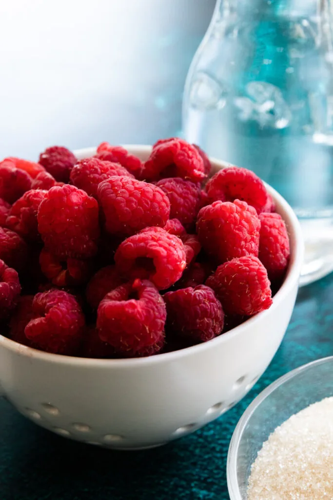 A bowl of fresh raspberries.