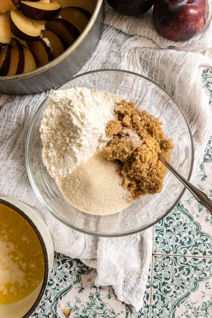 Flour, brown and white sugars, and a pinch of salt in a bowl for streusel topping.