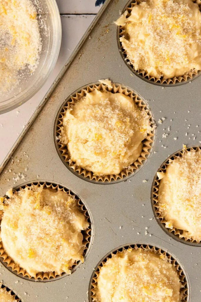 Lemon sugar sprinkled on the tops of the filled muffins.
