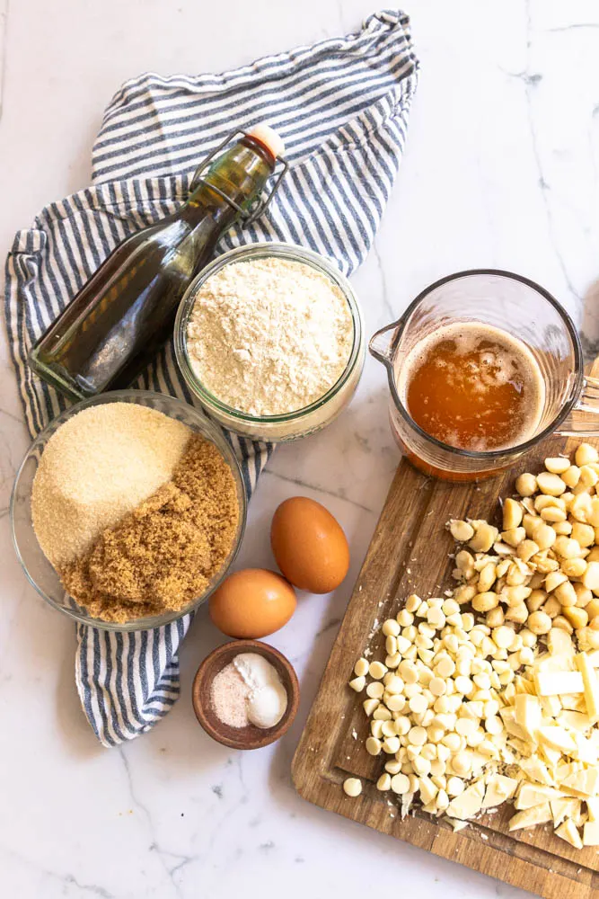 Cookie ingredients--brown butter, sugar, eggs, salt, baking soda and powder, flour, white chocolate, and macadamia nuts.