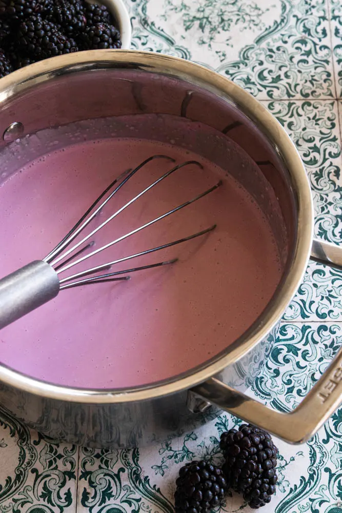 The cream, milk, and blackberry coulis mixed together and ready for the gelatin.