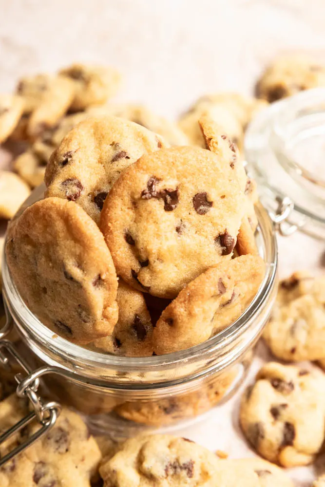 Mini cookies piled in a jar.